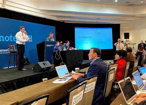 $1.8 million in domains sold in live domain name auction.